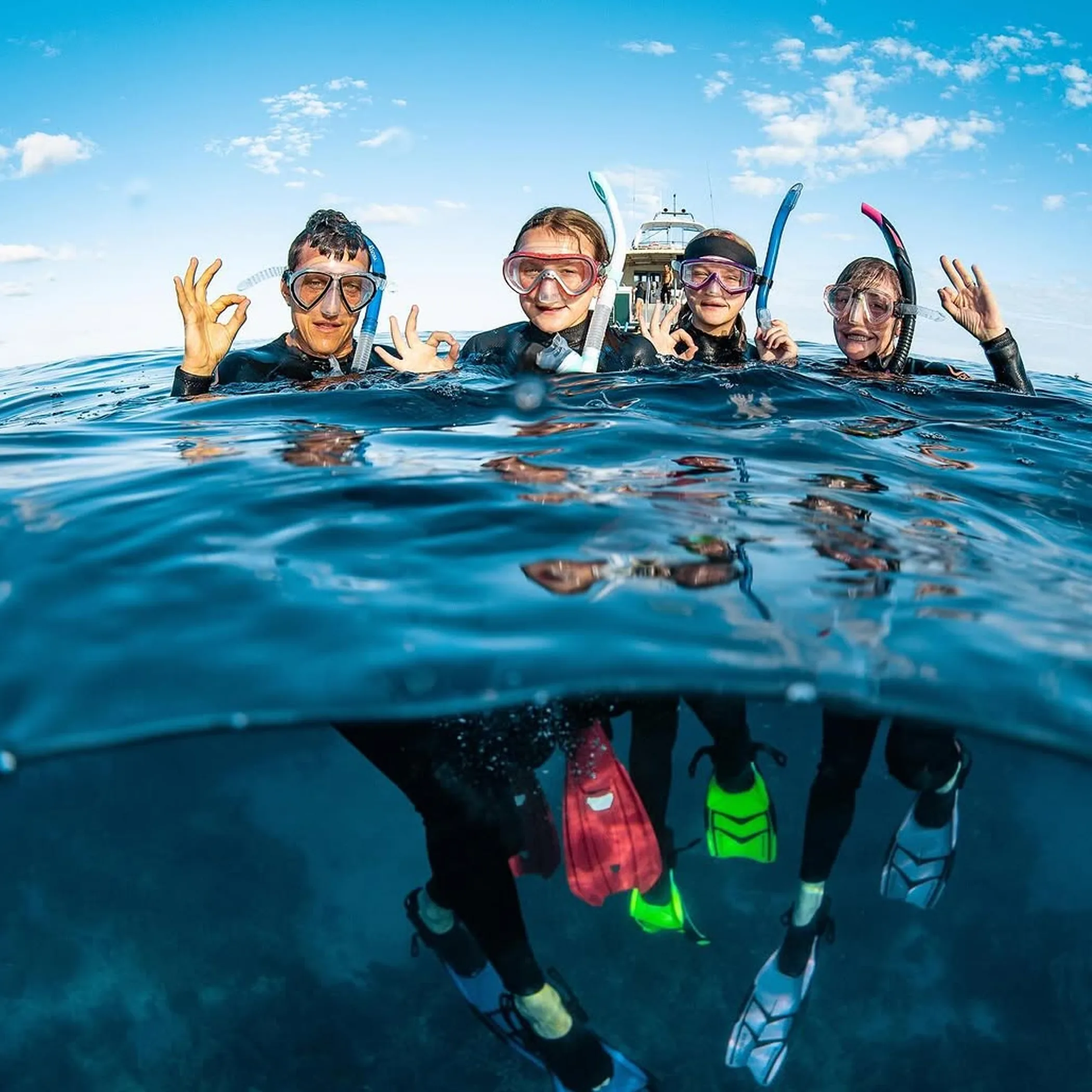 snorkelers swimming in clear water
